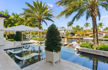 swimming pool with sunbeds